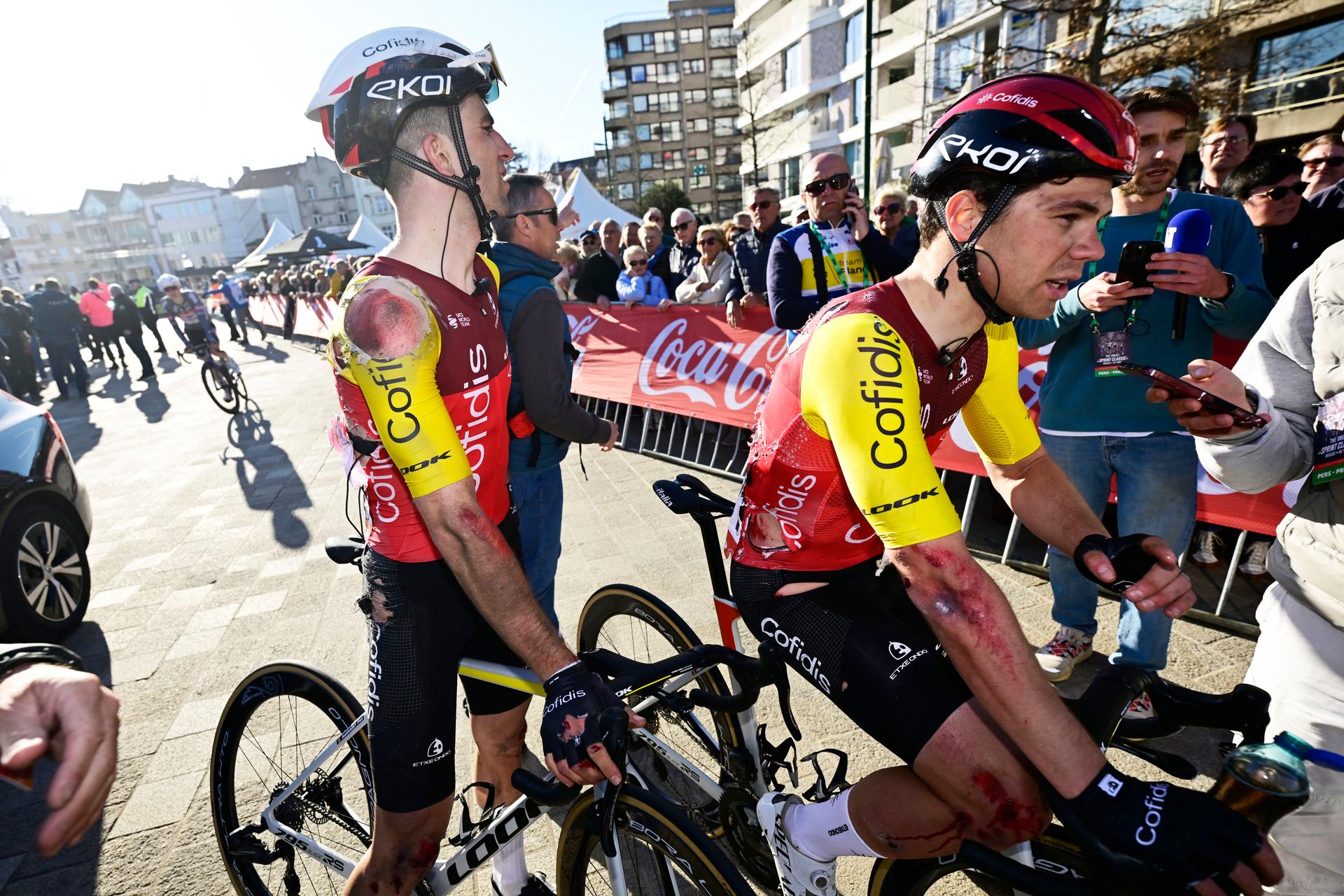 Belgian Piet Allegaert of Cofidis and Belgian Milan Fretin of Cofidis pictured after a fall during the 'Classic Brugge-De Panne' men's elite one-day cycling race, 195,6 km from Brugge to De Panne, Wednesday 26 March 2025. BELGA PHOTO DIRK WAEM