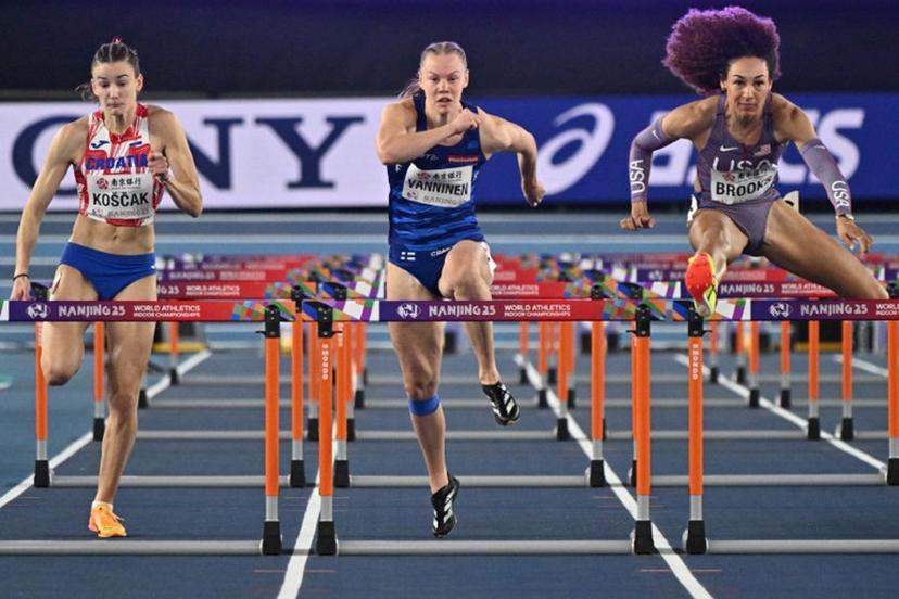 (L-R) Croatia's Jana Koscak, Finland's Saga Vanninen and USA's Taliyah Brooks compete in the women's pentathlon 60m hurdles heat during the Indoor World Athletics Championships in Nanjing, in eastern China's Jiangsu province, on March 21, 2025.  Pedro Pardo / AFP