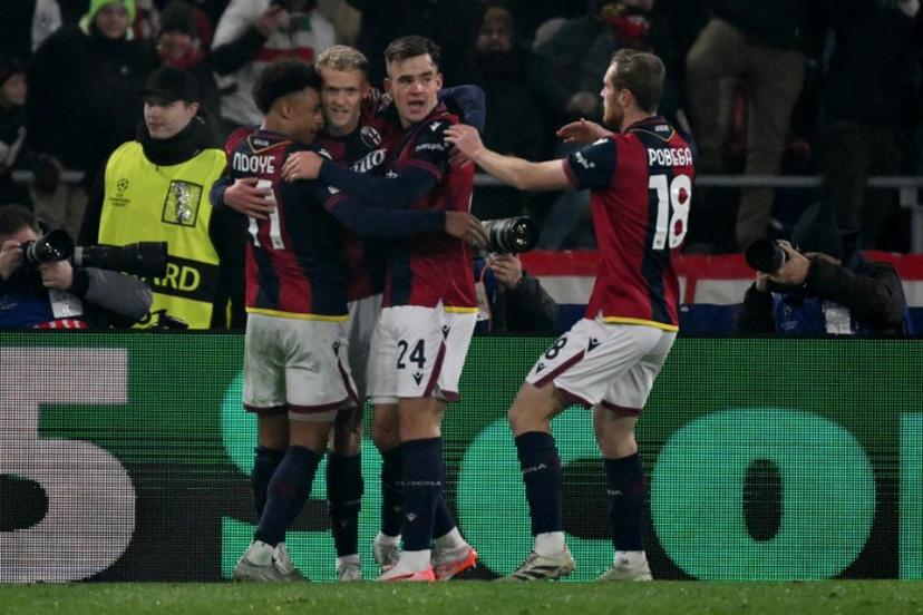 Bologna's Dutch forward #24 Thijs Dallinga celebrates scoring his team's first goal with teammates during the UEFA Champions League football match between Bologna and Borussia Dortmund at the Renato Dall'Ara stadium in Bologna on January 21, 2025.  Alberto PIZZOLI / AFP