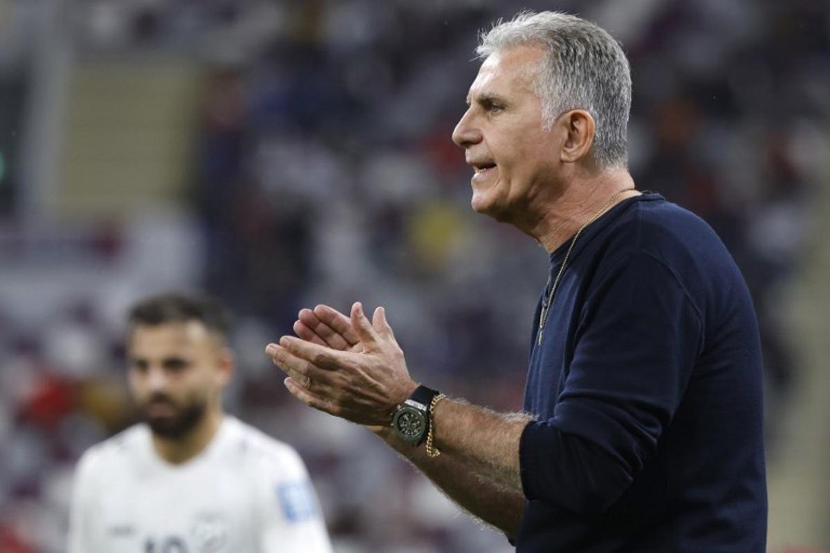 Qatar's Portuguese coach Carlos Queiroz speaks to his players during the 2026 FIFA World Cup AFC qualifiers football match between Qatar and Afghanistan at the Khalifa International Stadium on November 16, 2023.  KARIM JAAFAR / AFP