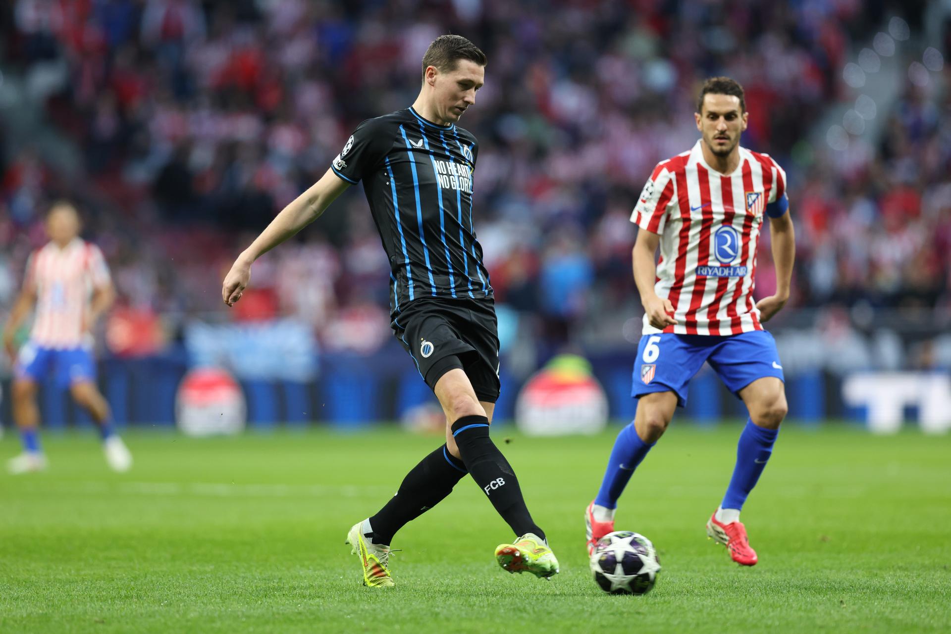 Club's Hans Vanaken and Atletico Madrid's Koke fight for the ball during a soccer game between Spanish team Atletico Madrid and Belgian Club Brugge, in Madrid, on Tuesday 24 February 2026, the return leg game in the Knockout phase play-offs of the UEFA Champions League tournament. BELGA PHOTO BRUNO FAHY