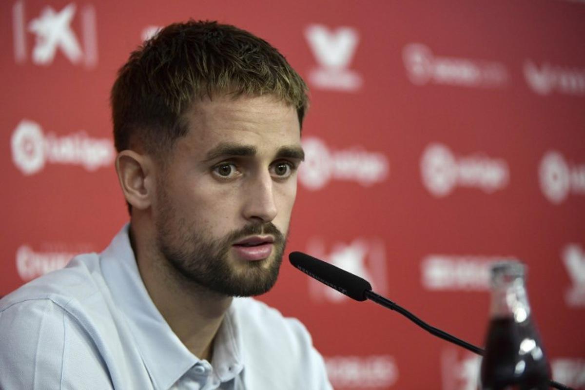 Belgian forward Adnan Januzaj talks to media during his official presentation as FC Sevilla football club's new player at the Ramon Sanchez Pizjuan stadium in Seville on September 7, 2022.     CRISTINA QUICLER / AFP