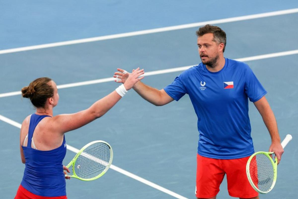 Czech Republic's Adam Pavlasek (R) and Barbora Krejcikova celebrate their victory against Norway's Viktor Durasovic and Ulrikke Eikeri in their mixed-doubles match at the United Cup tennis tournament on Ken Rosewood Arena in Sydney on January 5, 2026.  Izhar KHAN / AFP