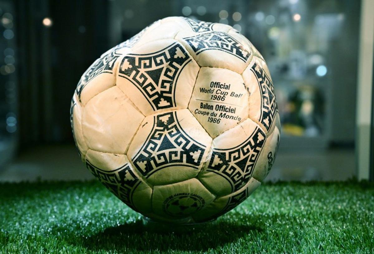 The ball that was used in the 1986 World Cup match between Argentina and England during which Argentina's Diego Maradona scored the "Hand of God" goal is displayed before auction at Heritage Auctions in Beverly Hills, California, on August 7, 2026.  The ball that Maradona used to score his infamous "Hand of God" goal is expected to sell for $10 million at a US auction this month. Maradona's goal in the quarter-final match at the Estadio Azteca saw him punch the ball past the England goalkeeper, with the South Americans ultimately winning 2-1. Frederic J. BROWN / AFP