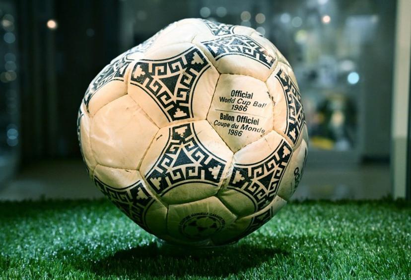 The ball that was used in the 1986 World Cup match between Argentina and England during which Argentina's Diego Maradona scored the "Hand of God" goal is displayed before auction at Heritage Auctions in Beverly Hills, California, on August 7, 2026.  The ball that Maradona used to score his infamous "Hand of God" goal is expected to sell for $10 million at a US auction this month. Maradona's goal in the quarter-final match at the Estadio Azteca saw him punch the ball past the England goalkeeper, with the South Americans ultimately winning 2-1. Frederic J. BROWN / AFP