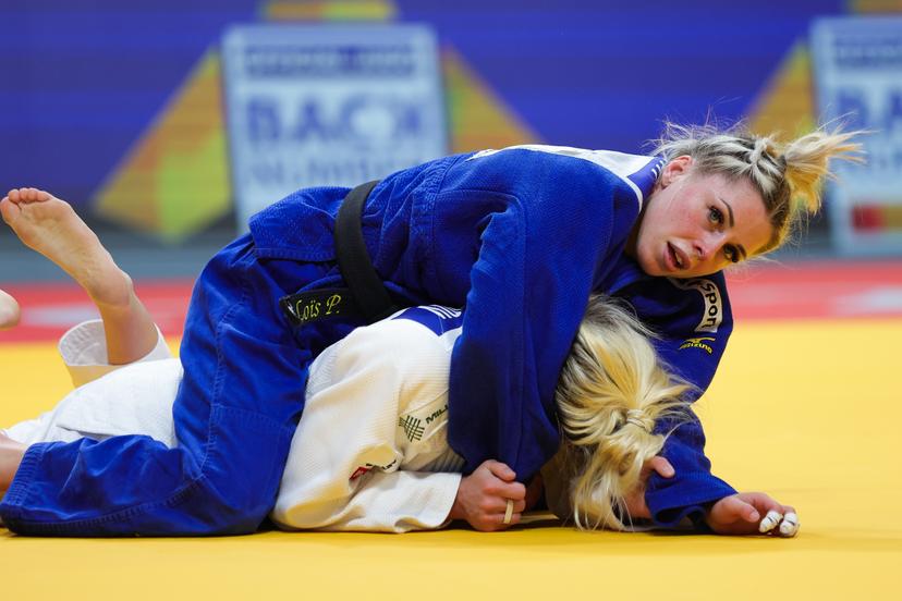 Belgian Lois Petit (blue gi) and Serbian Andrea Stojadinov (white gi) pictured in action during their bout in the Women's -48kg category, at the European Championships judo in Podgorica, Montenegro, on Wednesday 23 April 2025. The tournament is taking place from 23 tot 27 April 2025. BELGA PHOTO NIKOLA KRISTC