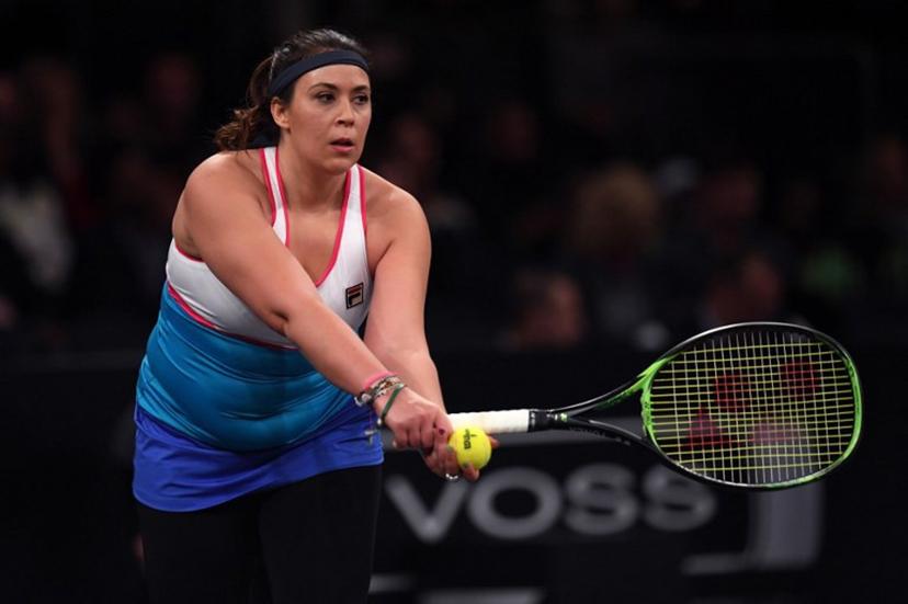 Marion Bartoli of France returns against Serena Williams of the US during the Tie Break Tens New York tournament at Madison Square Garden March 5, 2018 featuring eight of the tour's top female players competing for the $250,000 winner's prize.  TIMOTHY A. CLARY / AFP