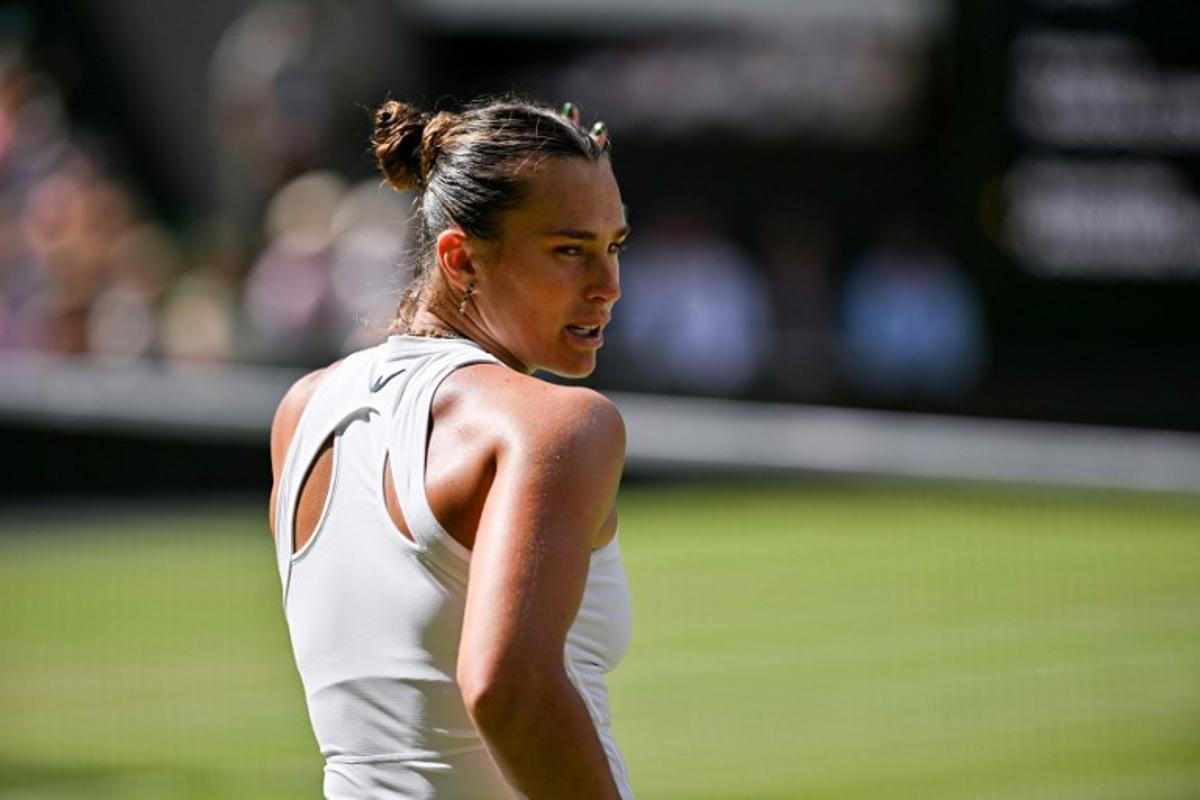 Belarus's Aryna Sabalenka reacts as she plays against US player Amanda Anisimova during their women's singles semi-final tennis match on the eleventh day of the 2025 Wimbledon Championships at The All England Lawn Tennis and Croquet Club in Wimbledon, southwest London, on July 10, 2025.  Glyn KIRK / AFP
