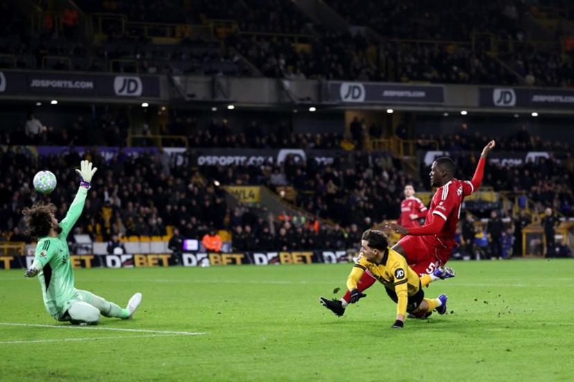 Wolverhampton Wanderers' Portugese midfielder #21 Rodrigo Gomes scores the team's first goal during the English Premier League football match between Wolverhampton Wanderers and Liverpool at the Molineux stadium in Wolverhampton, central England on March 3, 2026.  Darren Staples / AFP