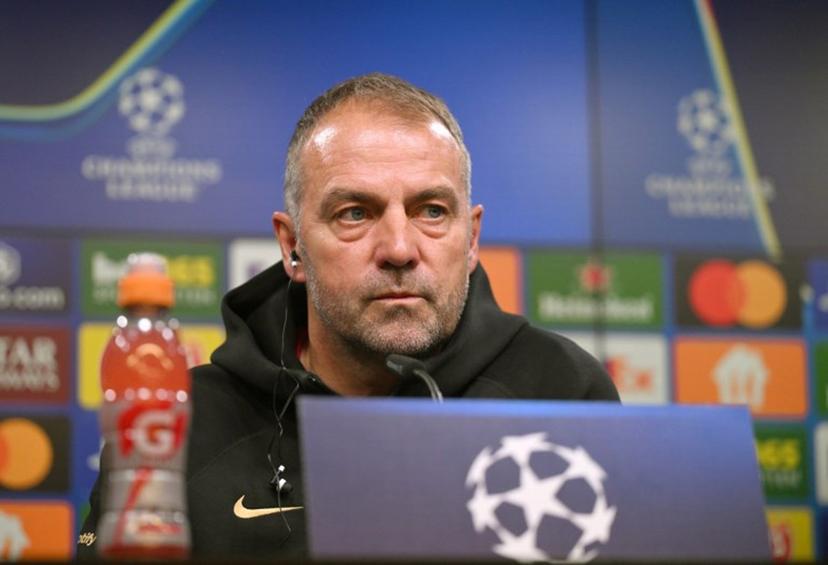 Barcelona's German head coach Hansi Flick addresses a press conference on the eve of the UEFA Champions League quarter-final second-leg football match BVB Borussia Dortmund v FC Barcelona at the Signal Iduna stadium in Dortmund on April 14, 2025.  Ina FASSBENDER / AFP