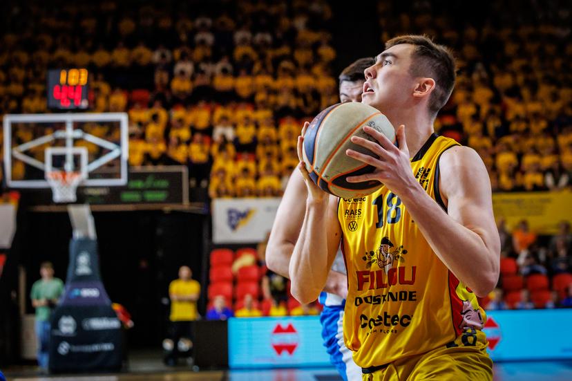 Aalst's Njegos Sikiras and Oostende's Matteo Verstraete fight for the ball during a basketball match between BC Oostende and Okapi Aalst, Friday 21 March 2025 in Oostende, on day 27 of the 'BNXT League' Belgian and Dutch first division basket championships. BELGA PHOTO KURT DESPLENTER