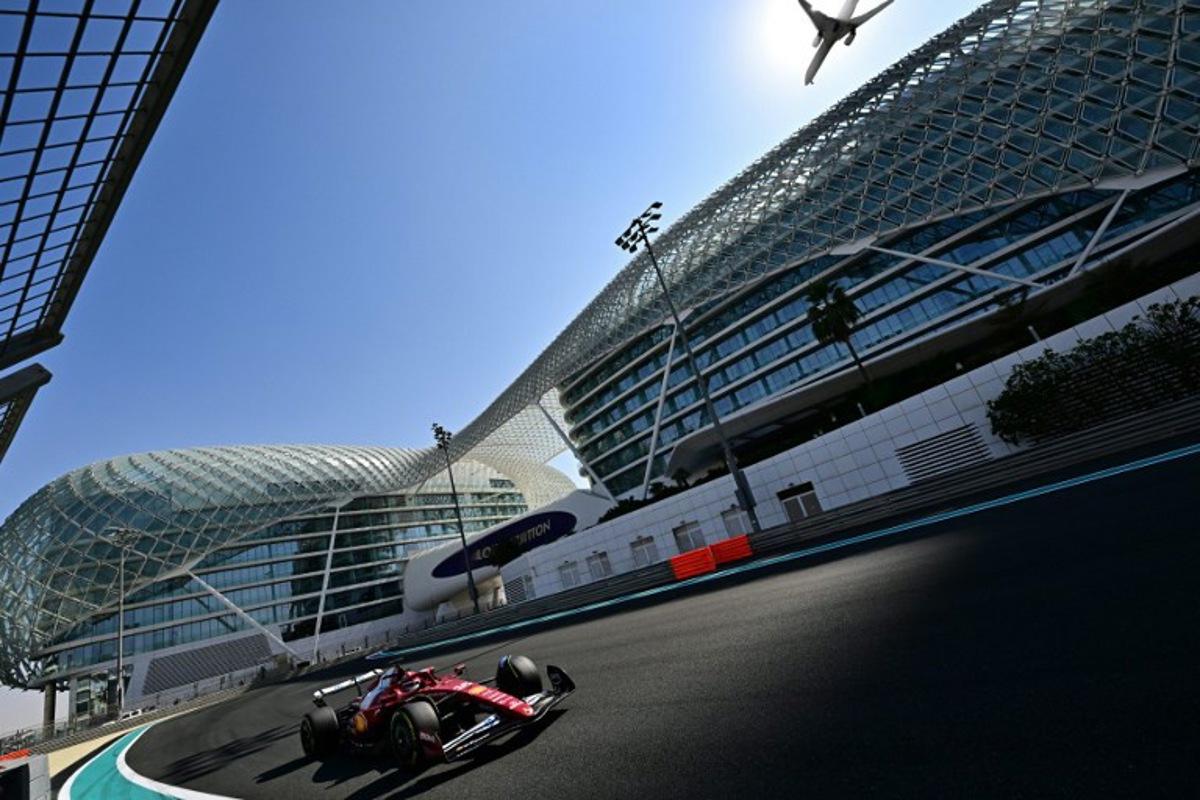 Ferrari's Monaco driver Charles Leclerc drives during the Pirelli test session at the Yas Marina Circuit in Abu Dhabi on December 9, 2025.   Giuseppe CACACE / AFP