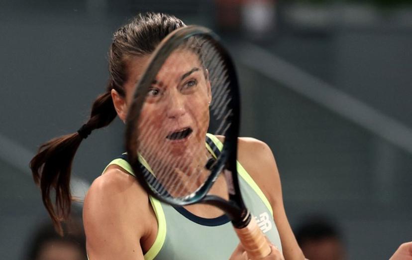 Romania's Sorana Cirstea returns the ball to Poland's Iga Swiatek during their second round of the 2024 WTA Tour Madrid Open tournament tennis match at Caja Magica in Madrid on April 27, 2024.  Thomas COEX / AFP