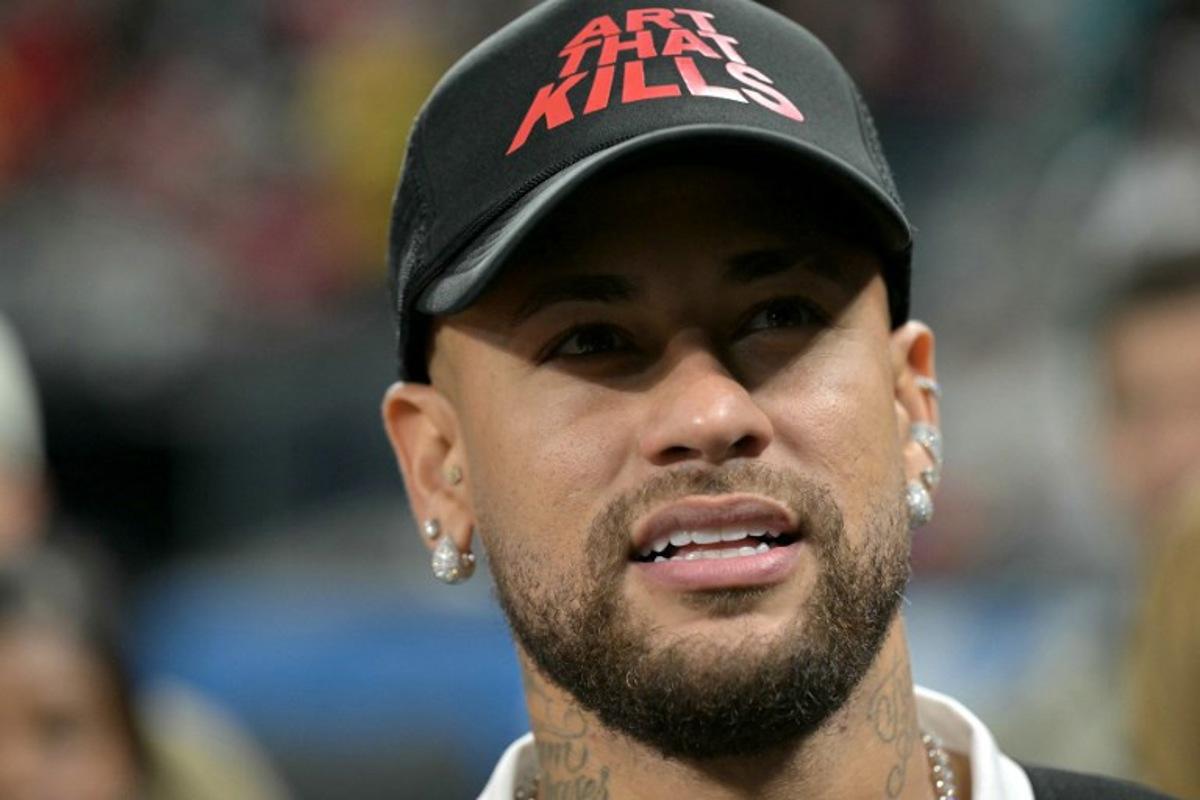 Brazilian football player Neymar gestures during the NFL game between the Kansas City Chiefs and Los Angeles Chargers at the Neo Quimica Arena Stadium in Sao Paulo, Brazil, on September 5, 2025.  NELSON ALMEIDA / AFP