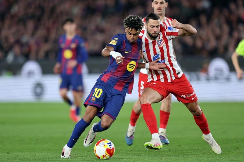 Barcelona's Spanish forward #10 Lamine Yamal and Atletico Madrid's Slovak defender #17 David Hancko fight for the ball during the Copa del Rey (King's Cup) semi final second leg football match between FC Barcelona and Club Atletico de Madrid at Camp Nou Stadium in Barcelona on March 3, 2026.   Josep LAGO / AFP