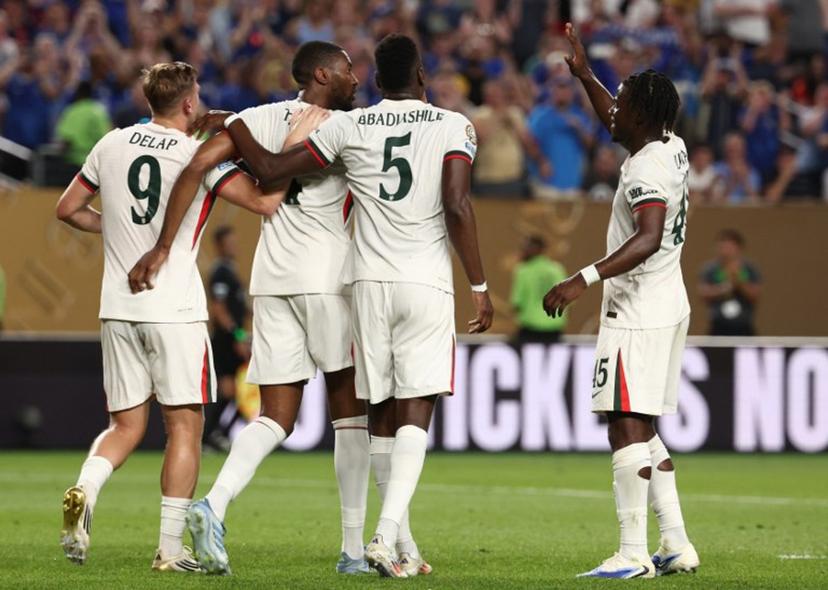 Chelsea's English defender #04 Tosin Adarabioyo (2nd L) celebrates after scoring the opening goal with teammates forward #09 Liam Delap, French defender #05 Benoit Badiashile and Belgian midfielder #45 Romeo Lavia during the FIFA Club World Cup 2025 Group D football match between Tunis' Esperance Sportive de Tunis and England's Chelsea at the Lincoln Financial Field stadium in Philadelphia on June 24, 2025.  FRANCK FIFE / AFP