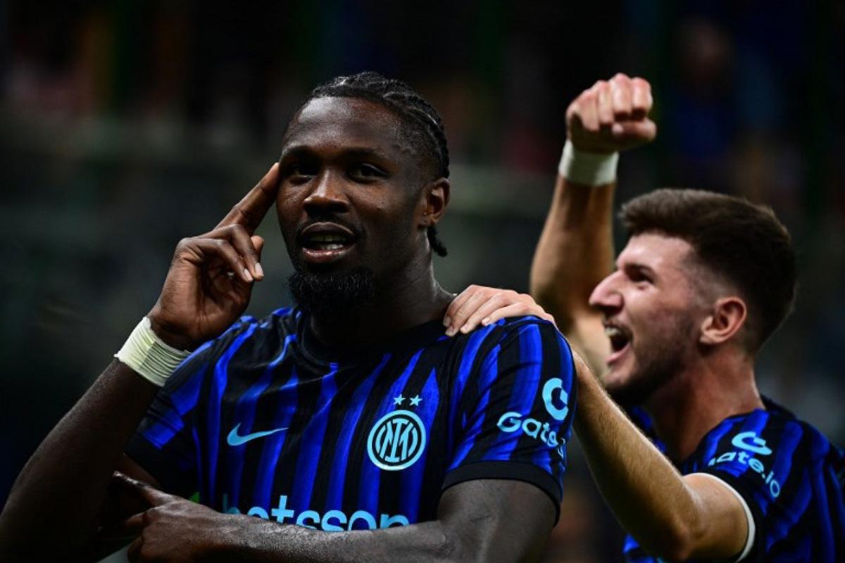 Inter Milan's French forward #09 Marcus Thuram celebrates after scoring his team's second goal during the Italian Serie A football match between Inter Milan and Torino at the San Siro Stadium in Milan, on August 25, 2025.  Piero CRUCIATTI / AFP