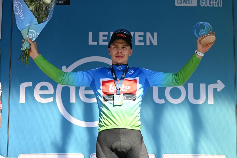 Belgian Arnaud De Lie of Lotto Cycling Team celebrates on the podium in the leader's jersey after winning the fifth and last stage of the 'Renewi Tour' multi-stage cycling race, 185km from and to Leuven on Sunday 24 August 2025. The five-day race takes place in Belgium and the Netherlands.  BELGA PHOTO DAVID PINTENS