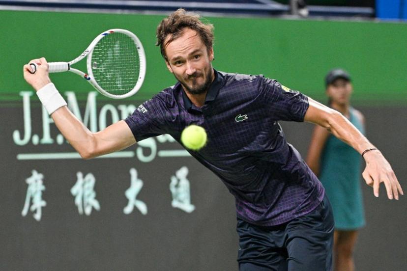 Russia's Daniil Medvedev hits a return to France's Arthur Rinderknech during their men's singles semi-final match at the Shanghai Masters tennis tournament in Shanghai on October 11, 2025.  Hector RETAMAL / AFP