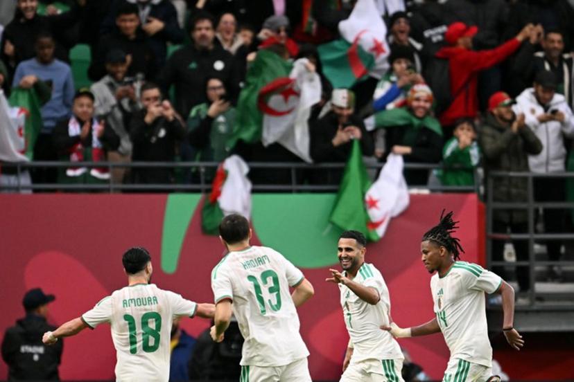 Algeria's forward #7 Riyad Mahrez (2R) celebrates scoring the team's second goal during the Africa Cup of Nations (CAN) Group E football match between Algeria and Sudan at Moulay Hassan Stadium in Rabat on December 24, 2025.   SEBASTIEN BOZON / AFP