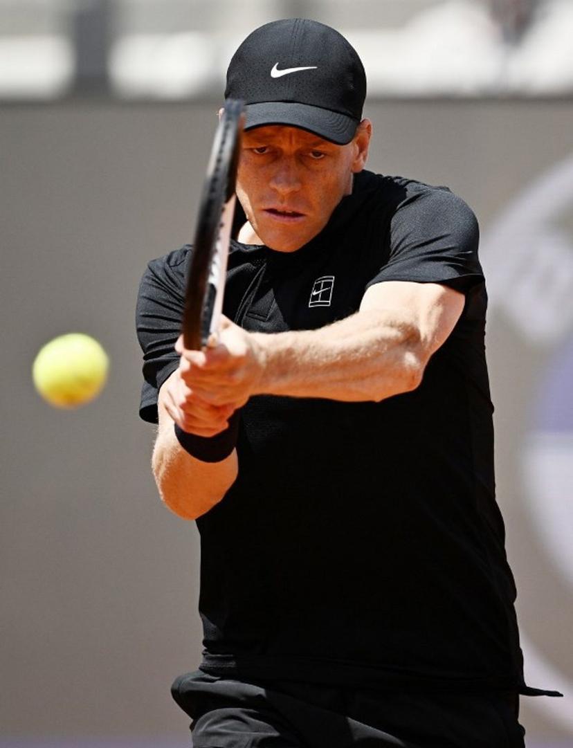 Italy's Jannik Sinner hits a return to Russia's Andrey Rublev during the ATP Rome Open tennis tournament at Foro Italico in Rome on May 14, 2026.   Tiziana FABI / AFP