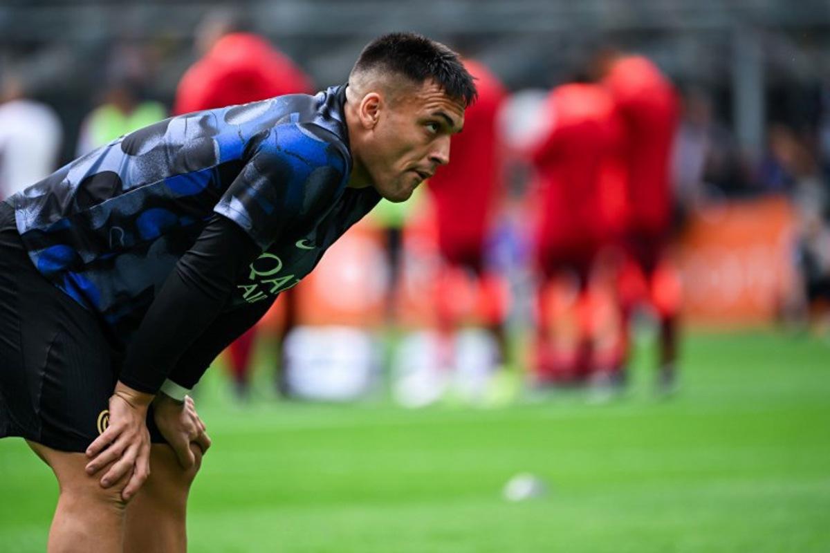 Inter Milan's Argentine forward #10 Lautaro Martinez looks on during the warm up ahead of the Italian Serie A football match between Inter Milan and Roma at the San Siro stadium in Milan on April 27, 2025.  Piero CRUCIATTI / AFP
