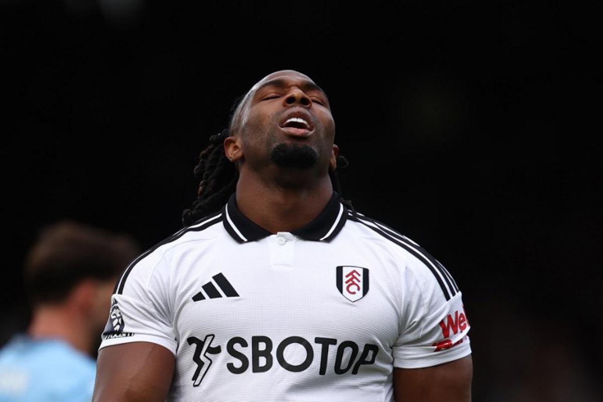 Fulham's Spanish midfielder #11 Adama Traore reacts to a missed chance during the English Premier League football match between Fulham and Manchester City at Craven Cottage in London on May 25, 2025.  Anne-Christine POUJOULAT / AFP
