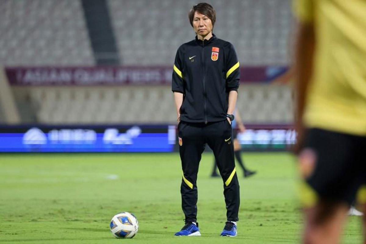 China's coach Li Tie looks on ahead of the 2022 Qatar World Cup Asian Qualifiers football match between China and Oman, at the Sharjah Football Stadium in the Emirati city, on November 11, 2021.  Giuseppe CACACE / AFP