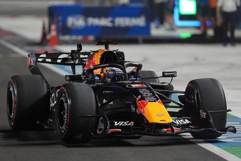 Red Bull Racing's Dutch driver Max Verstappen drives into the pit lane during the qualifying session ahead of the Formula One Singapore Grand Prix at the Marina Bay Street Circuit in Singapore on October 10, 2026.  Ng Han Guan / POOL / AFP
