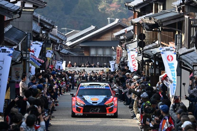 Ott Tanak and his co-driver Martin Jarveoja of Estonia drive their Hyundai i20 N Rally1 through the traditional Japanese town of Iwamura during the Rally Japan, the 13th round of the FIA World Rally Championships, in Ena city, Gifu prefecture on November 8, 2025.  Toshifumi KITAMURA / AFP