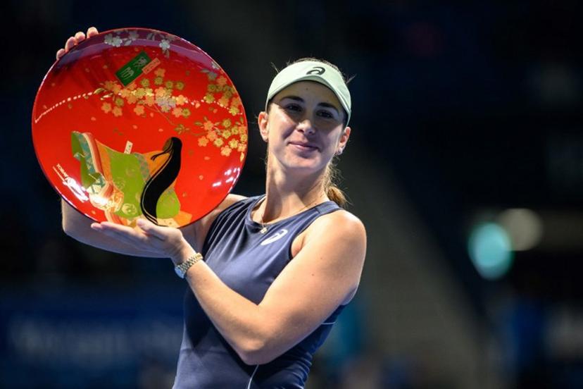 Switzerland's Belinda Bencic celebrates with the trophy after her victory Czech Republic's Linda Noskova during the women's singles final at the Pan Pacific Open tennis tournament in Tokyo on October 26, 2025.  Philip FONG / AFP
