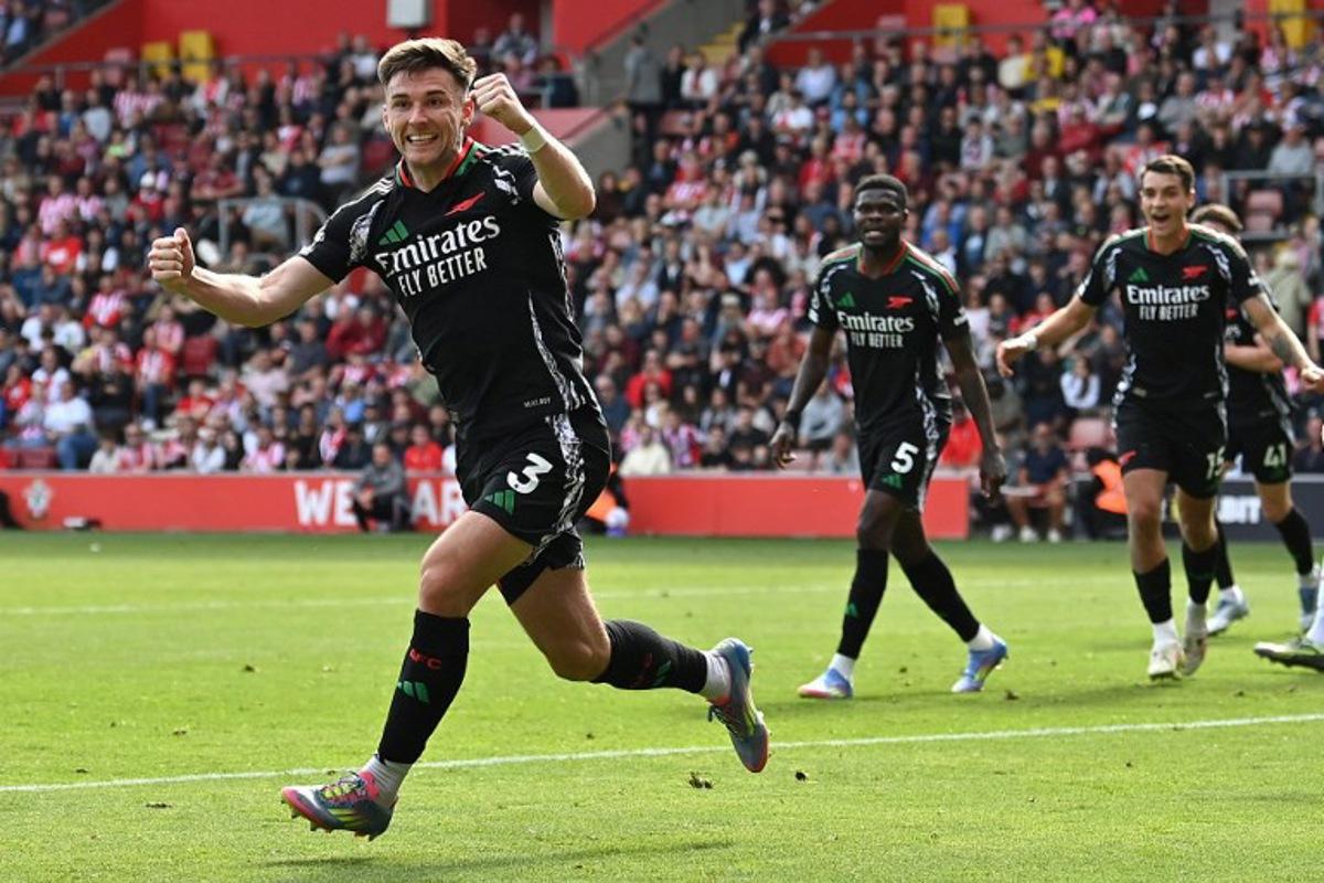 Arsenal's Scottish defender #03 Kieran Tierney celebrates after scoring a goal during the English Premier League football match between Southampton and Arsenal at St Mary's Stadium in Southampton, southern England on May 25, 2025.  Glyn KIRK / AFP