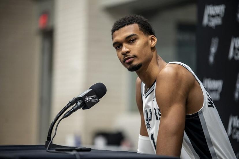 French basketball player Victor Wembanyama speaks to reporters during the San Antonio Spurs media day at the Victory Capital Performance Center in San Antonio, Texas on September 29, 2025. Wembanyama has been cleared by the team's medical staff to play for the upcoming season. SERGIO FLORES / AFP