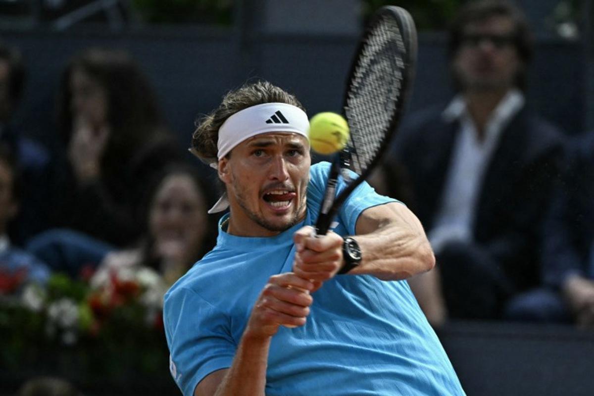 Germany's Alexander Zverev returns a ball to Italy's Flavio Cobolli during their 2026 ATP Tour Madrid Open tennis tournament quarter-final singles match at the Caja Magica in Madrid, on April 30, 2026.  Javier SORIANO / AFP