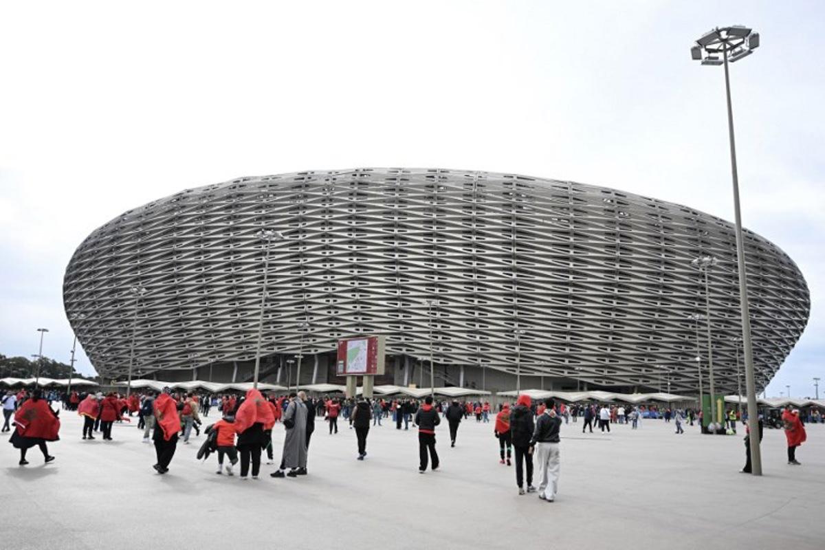 Moroccan fans arrive for the Africa Cup of Nations (CAN) group A  football match between Morocco and Comoros at Prince Moulay Abdellah Stadium in Rabat on December 21, 2025.   Paul ELLIS / AFP
