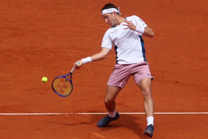 Norway's Casper Ruud returns the ball to Russia's Daniil Medvedev during their 2025 ATP Tour Madrid Open tennis tournament quarter-final match at the Caja Magica in Madrid, on May 1, 2025.  Pierre-Philippe MARCOU / AFP
