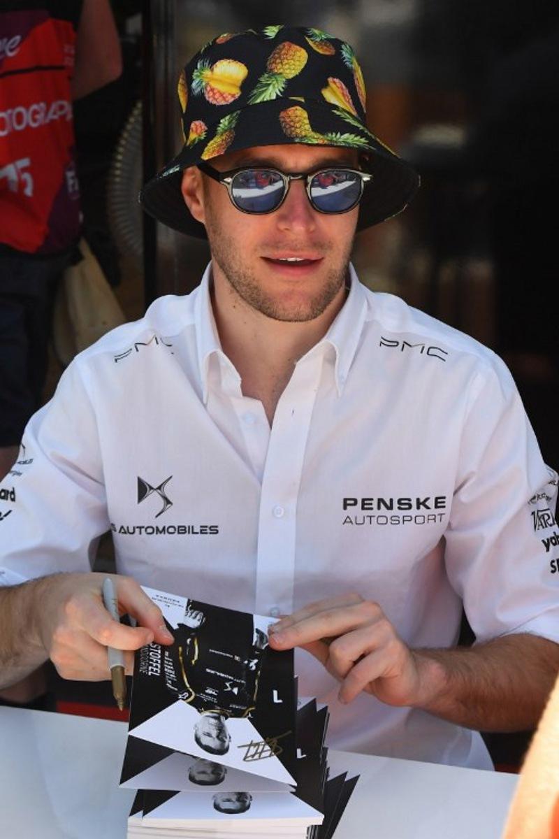 DS Penske's driver Stoffel Vandoorne signs autographs ahead of the 2023 Cape Town E-Prix in Cape town on February 25, 2023.  Rodger Bosch / AFP