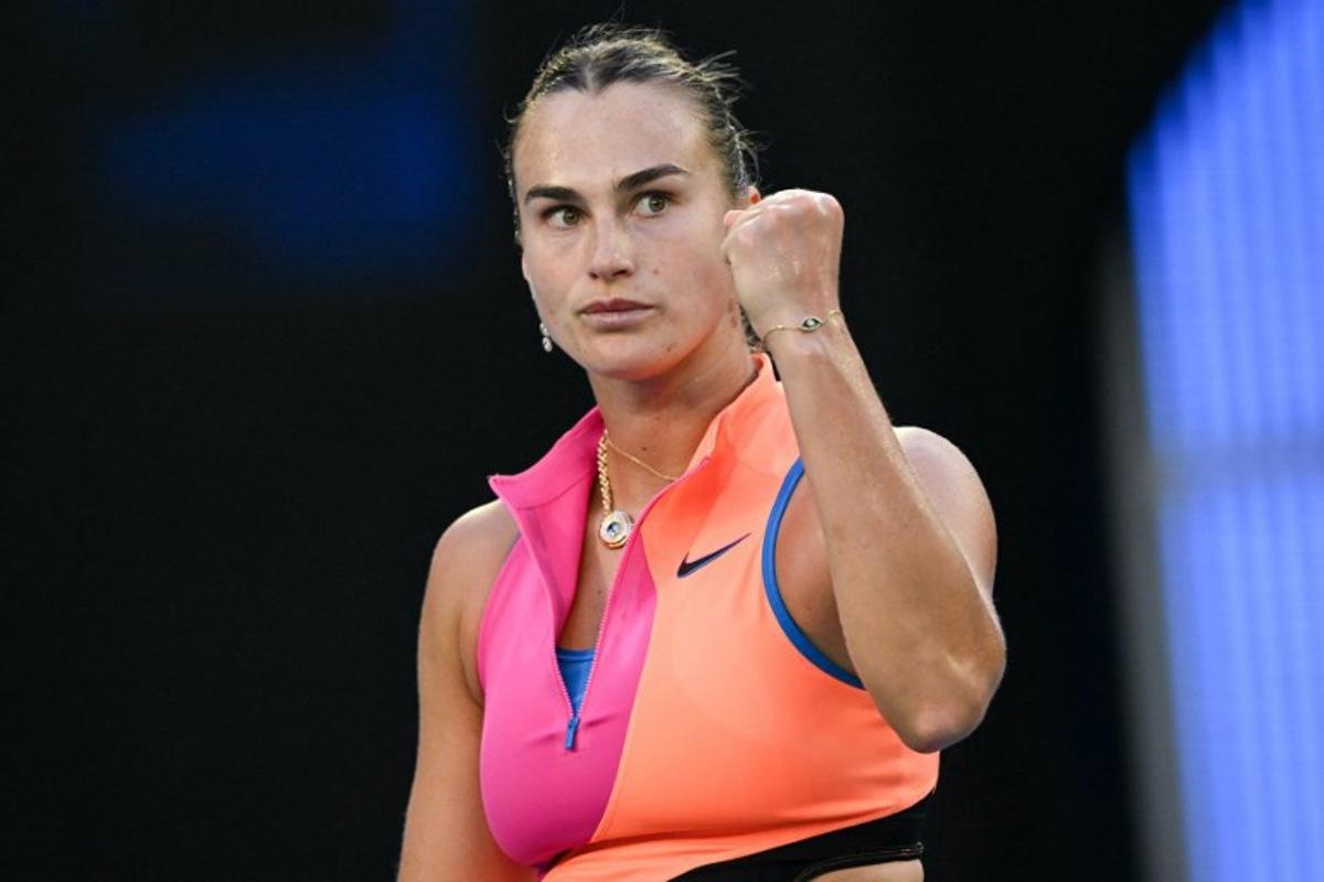 Belarus' Aryna Sabalenka reacts after a point against France's Tiantsoa Rakotomanga Rajaonah during their women's singles match on day one of the Australian Open tennis tournament in Melbourne on January 18, 2026.  Paul Crock / AFP