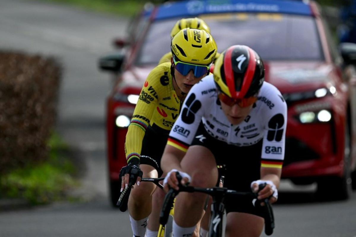 FDJ United-SUEZ's German rider Franziska Koch cycles in a breakway ahead of Team Visma - Lease a Bike's French rider Pauline Ferrand-Prévot during the 6th edition of the Women Paris-Roubaix one-day classic cycling race, 143.1 km between Denain and Roubaix, northern France, on April 12, 2026.   NICOLAS TUCAT / AFP