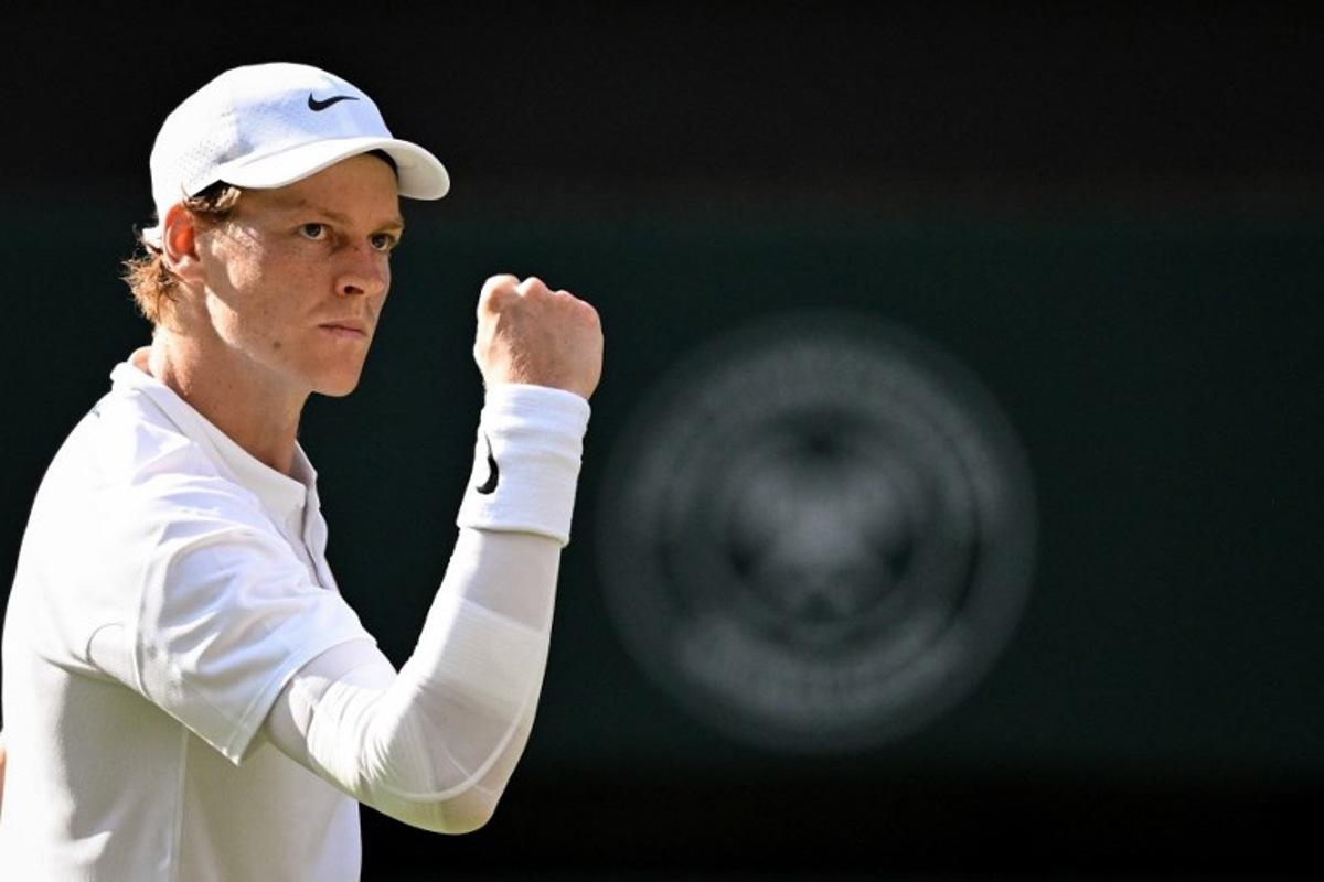 Italy's Jannik Sinner reacts after a point as he plays against Spain's Carlos Alcaraz during their men's singles final tennis match on the fourteenth day of the 2025 Wimbledon Championships at The All England Lawn Tennis and Croquet Club in Wimbledon, southwest London, on July 13, 2025.  Kirill KUDRYAVTSEV / AFP