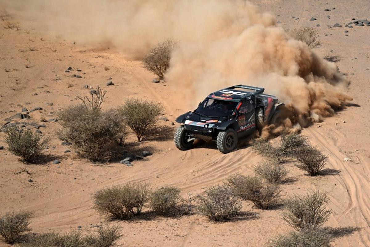 The Dacia Sandriders's Qatari driver Nasser Al‑Attiyah and Belgian co‑pilot Fabian Lurquin compete in Stage 11 of the 48th edition of the Dakar Rally 2026, between Bisha and al-Henakiyah, Saudi Arabia, on January 15, 2026.  Giuseppe CACACE / AFP