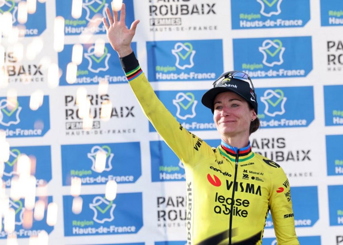 Second-placed Team Visma - Lease a Bike's Dutch rider Marianne Vos celebrates on the podium of the 6th edition of the Women Paris-Roubaix one-day classic cycling race, 143.1 km between Denain and Roubaix, at the Vélodrome André-Pétrieux in Roubaix, northern France, on April 12, 2026.  Francois LO PRESTI / AFP