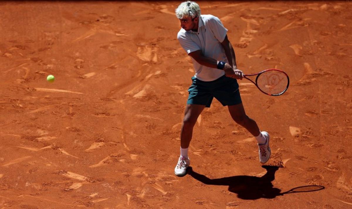 Spain's Daniel Merida returns the ball to Greece's Stefanos Tsitsipas during their 2026 ATP Tour Madrid Open tennis tournament third round singles match at the Caja Magica in Madrid, on April 27, 2026.  Thomas COEX / AFP