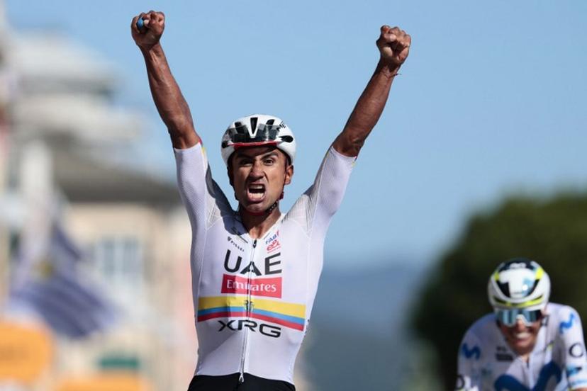 UAE Team Emirates - XRG Ecuadorian rider Jhonatan Narvaez crosses the finish line and wins ahead of Movistar Team Spanish rider Enric Mas the 11th stage of the Giro d'Italia 2026 - Tour of Italy cycling race between Porcari and Chiavari, Italy, on May 20, 2026.  Luca Bettini / AFP