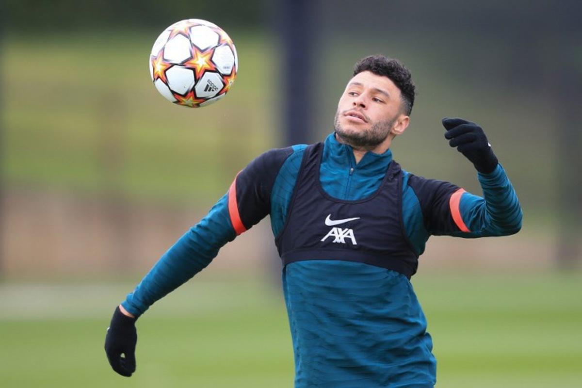 Liverpool's English midfielder Alex Oxlade-Chamberlain controls the ball as he attends a team training session at Anfield Stadium in Liverpool, north west England, on April 26, 2022, on the eve of their UEFA Champions League semi-final first leg  football match against Villareal.  Lindsey Parnaby / AFP
