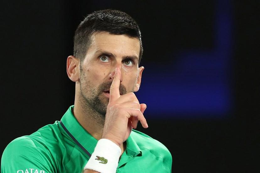 Serbia's Novak Djokovic reacts on a point to Netherlands' Botic van de Zandschulp during their men's singles match on day seven of the Australian Open tennis tournament in Melbourne on January 24, 2026.  Martin KEEP / AFP