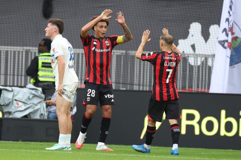 Nice's French forward #07 Gauthier Hein (R) celebrates with Nice's Belgian midfielder #28 Axel Witsel (L) after scoring a goal during the French L1 football match between OGC Nice and RC Strasbourg Alsace at the Allianz Riviera Stadium in Nice on October 11, 2026.  Valery HACHE / AFP