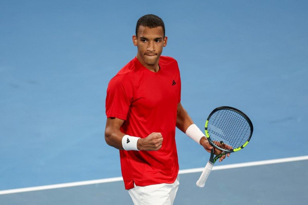 Canada's Felix Auger-Aliassime celebrates after his victory against China's Zhang Zhizhen at their men's singles match during the United Cup tennis tournament in Ken Rosewall Arena, Sydney on January 4, 2026.  Izhar KHAN / AFP