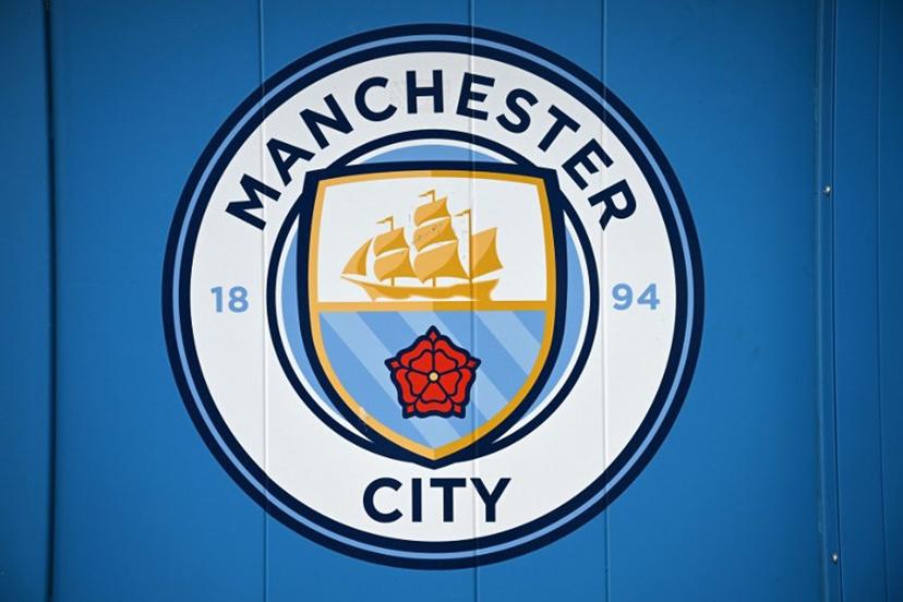 A logo is pictured outside the Etihad Stadium, the home ground of Manchester City football club, in Manchester, north-west England on September 30, 2026. The Premier League said on September 29 that Manchester City have been found guilty of serious breaches of the Premier League's financial rules over a nine-season period between 2009 and 2018. Oli SCARFF / AFP