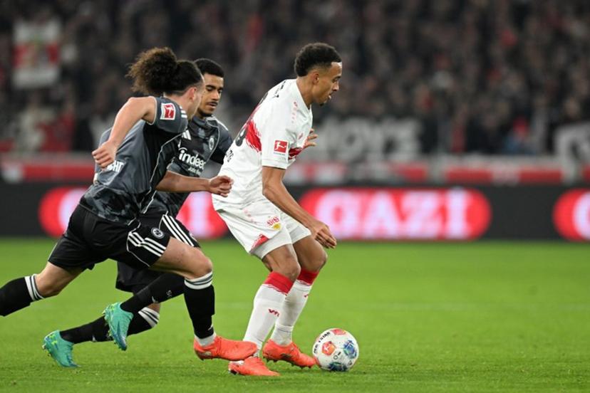 Stuttgart's German forward #18 Jamie Leweling vies for the ball with Frankfurt's German forward #07 Ansgar Knauff and Frankfurt's Belgian defender #03 Arthur Theate during the German first division Bundesliga football match between VfB Stuttgart and Eintracht Frankfurt in Stuttgart, southern Germany, on January 13, 2026.  THOMAS KIENZLE / AFP
